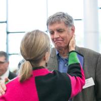 Fred Keller speaking with a woman.